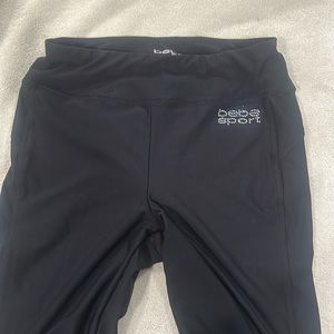 Bebe sport black leggings, strappy detail at bottom